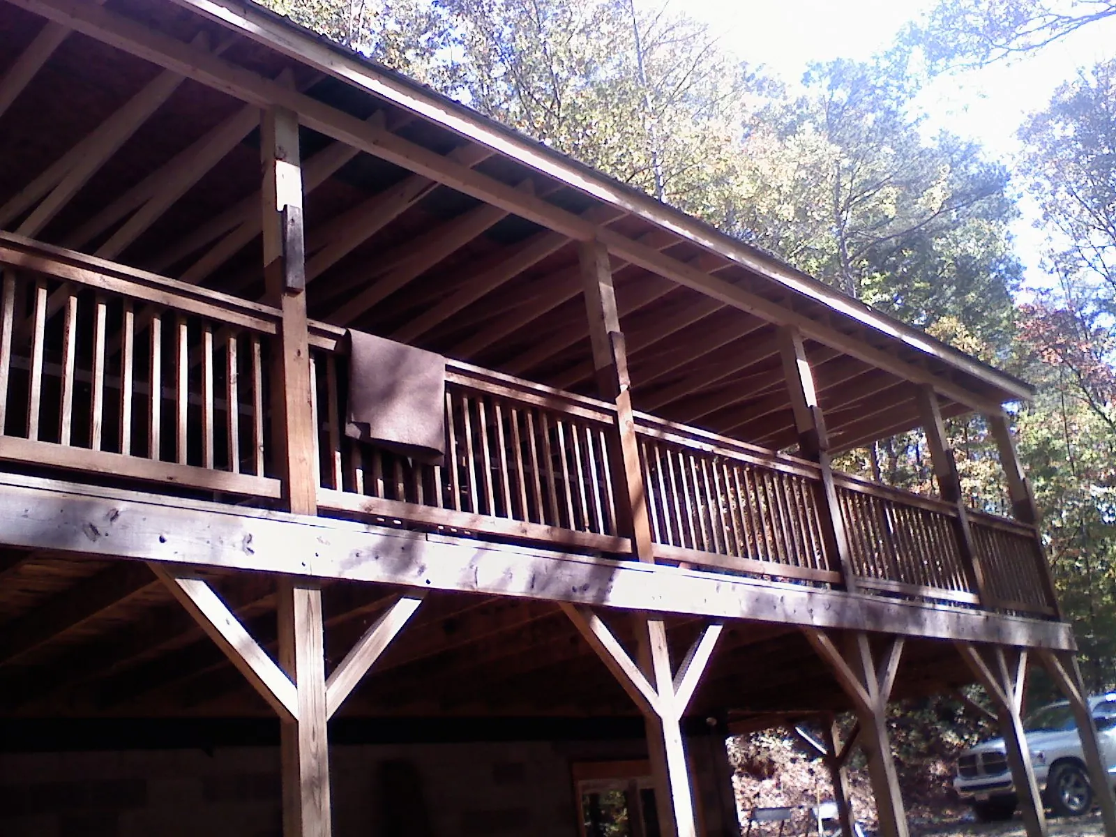 Timber framing under a new elevated porch and deck — Roof Leak Repair in Pine Prairie by Roofing Brothers